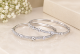 Elegant Diamond Bangles on Cream Marble
